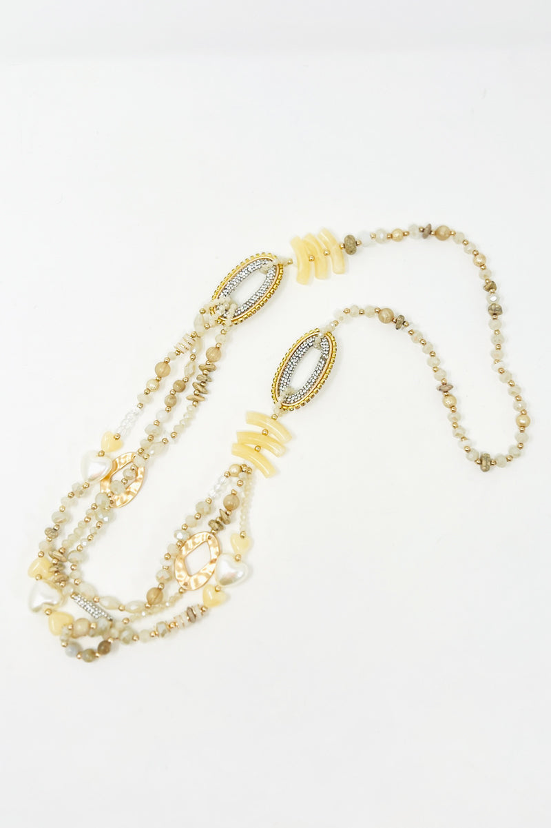 neutral triple layered beaded necklace 
