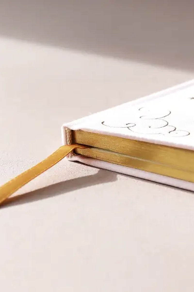 pink-notebook-with-gold-edges